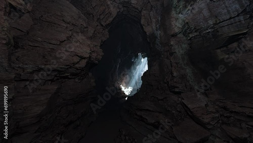 A cave filled with lots of rocks and water photo