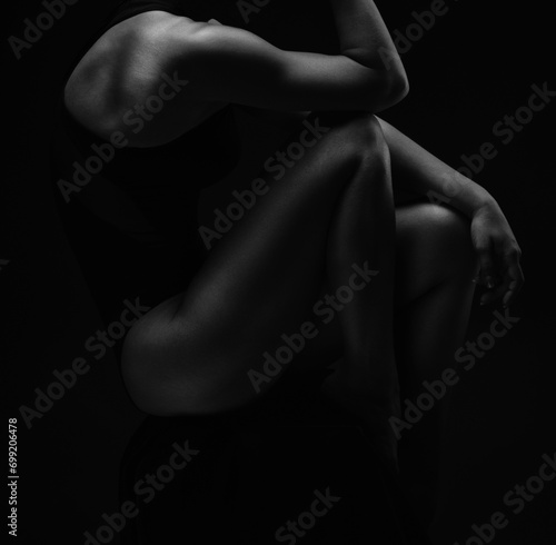Black-white silhouette of female shoulders and hands . Female silhouette. photo
