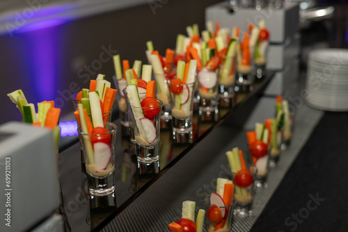 Party appetizer with celery carrots and tomato 