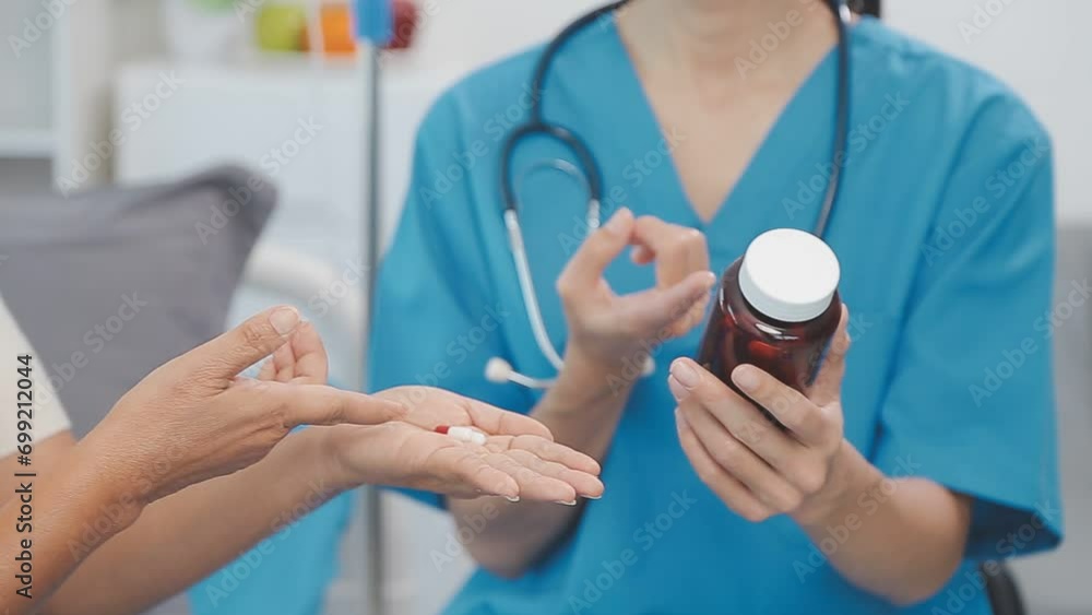 Women Asian doctors hold the patient hand and encourage and provide medical advice While checking the patient health in bed. Concept of Care and compassion, antenatal care, Threatened abortion Women Asian doctors hold the patient hand and encourage and provide medical advice While checking the patient health in bed. Concept of Care and compassion, antenatal care, Threatened abortion