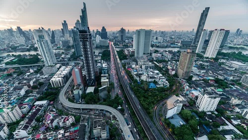 Cityscape of Trident road at Sathorn, Taksin bridge and illuminated traffic at Bangkok, Thailand photo