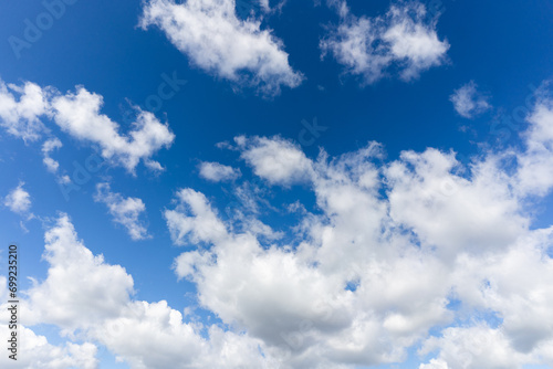 Fototapeta Naklejka Na Ścianę i Meble -  Blue sky adorned with wispy clouds. A tranquil canvas capturing the essence of crisp fall days and nature's tranquility.