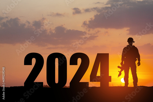 Silhouette of soldier and 2024 against the sunrise or sunset. Armed forces. Concept of military conflicts in 2024.
