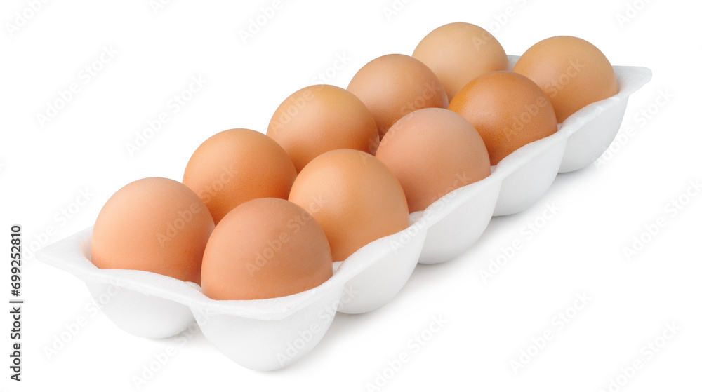 A carton of ten fresh brown eggs isolated on white background, with the natural variation in color and the concept of organic produce
