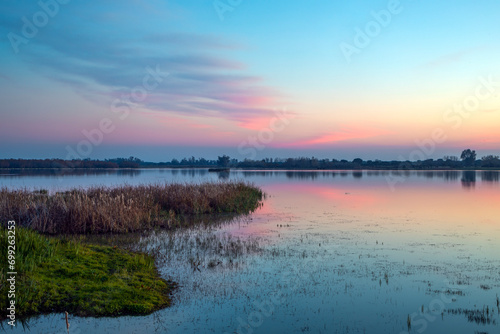 Beautiful lagoon landscape with birds in the Doñana National Park, Huelva, Anadalucia, Spain, at sunset photo