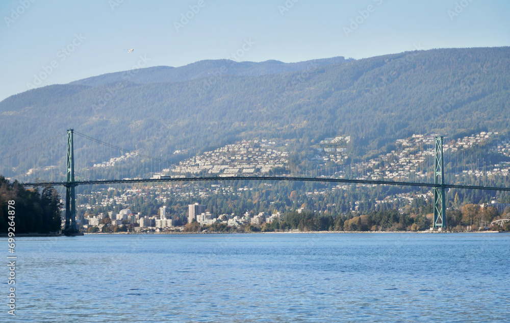Beautiful view of the Lions Gate Bridge connecting the North Shore with Downtown Vancouver as seen from Stanley Park during a fall season in Vancouver, British Columbia, Canada