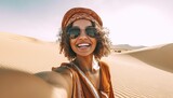 Happy female tourist taking selfie on sand dunes in the Africa desert, Sahara National Park , Influencer travel blogger enjoying trip while takes self portrait , Summer vacation and weekend activities