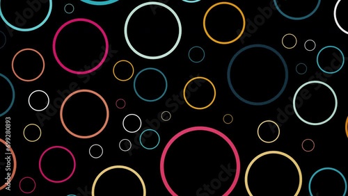2D animation of rotating colourful circle shapes on black background, pattern of circles with the displacement effect and slow rotating, abstract animated background photo
