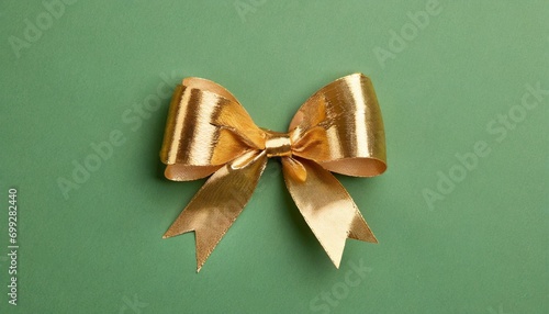 Colorful gold bow on green background