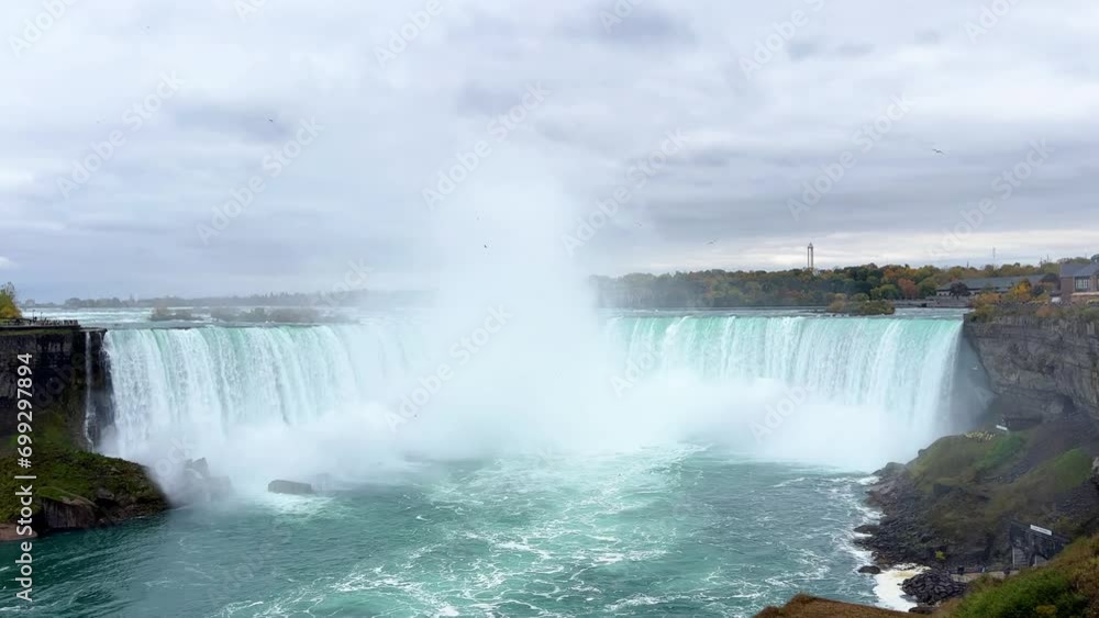 Amazing Niagara Falls in autumn. Waterfall on the international border between Canada and the United States. A breathtaking sight, a unique natural park. View of Horseshoe Falls from Table Rock Amazing Niagara Falls in autumn. Waterfall on the international border between Canada and the United States. A breathtaking sight, a unique natural park. View of Horseshoe Falls from Table Rock
