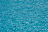The texture of the water surface in the pool as a background.