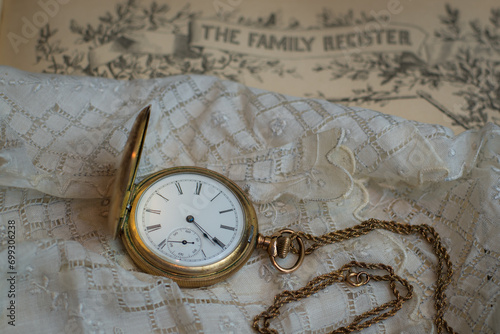 фотографія Sentimental photo of family items in times past with a family register, handkerc
