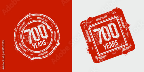 A group of 700th anniversary logos drawn as stamps and enclosed in a red frame for celebration. Grunge stamp texture. Holiday stamps. Collection of postage stamps. Vector round and rectangular stamps photo