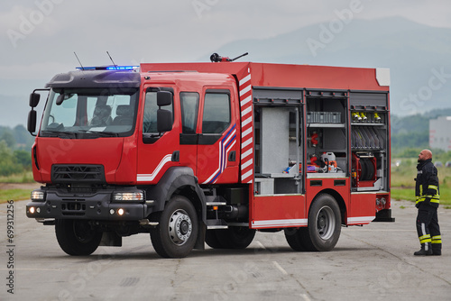 A firefighter meticulously prepares a modern firetruck for a mission to evacuate and respond to dangerous situations  showcasing the utmost dedication to safety and readiness in the face of a fire