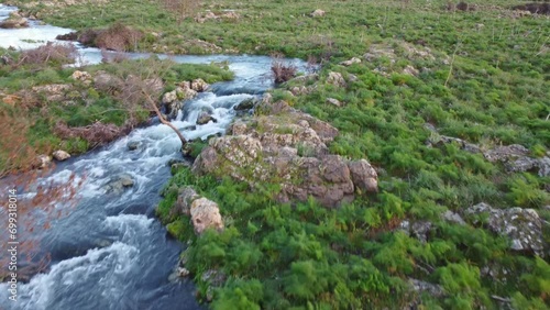 A seasonal river flows under the massive snowcovered Etna volcano. Favare Santa Venera