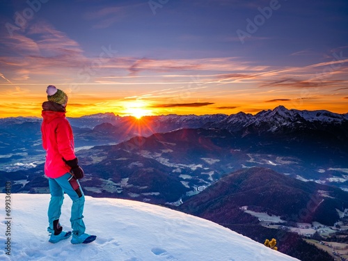 Mountaineer looks into the sunrise on the Berchtesgadener Hochthron, Untersberg, Berchtesgaden, Berchtesgadener Land, Upper Bavaria, Bavaria, Germany, Europe photo