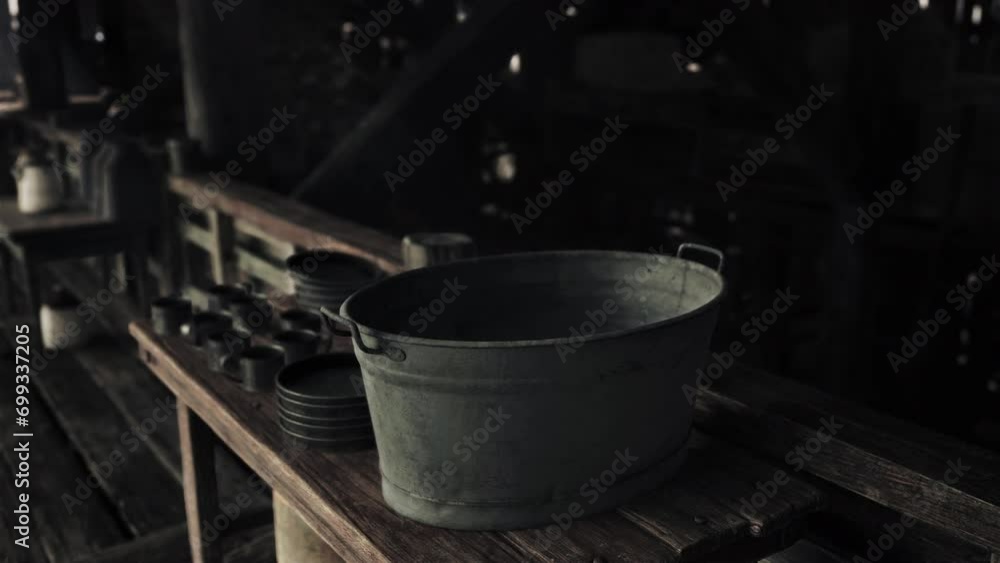 A bucket sitting on top of a wooden table A bucket sitting on top of a wooden table