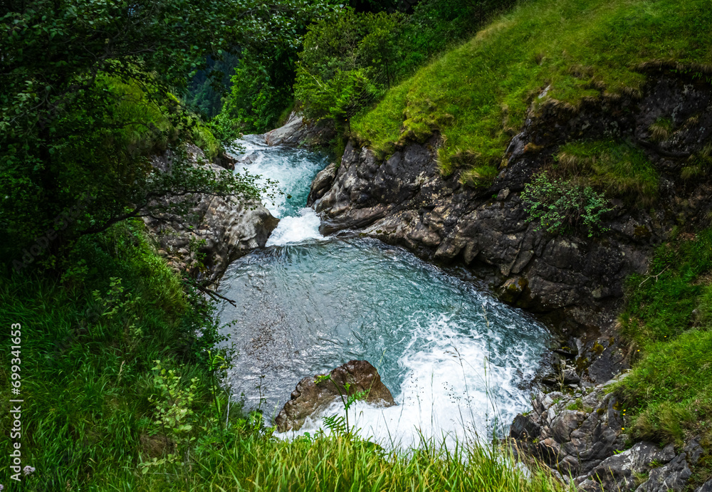 Hiking to the Parcines Waterfalls near Meran in South Tyrol Italy.  - obrazy, fototapety, plakaty 
