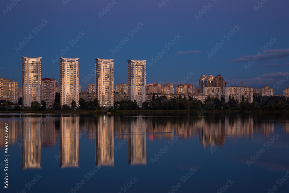 Tall houses near the river, city near the river