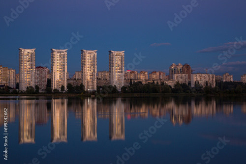 Tall houses near the river, city near the river