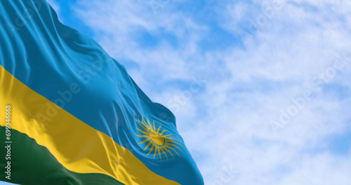 Close-up of Rwanda national flag waving on a clear day photo