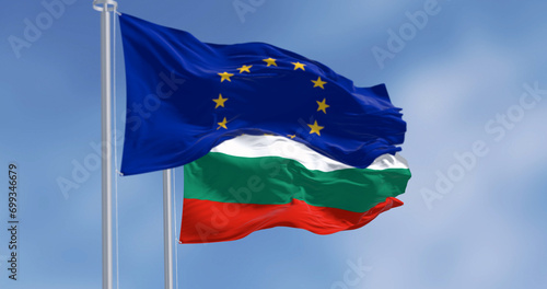 Flags of Bulgaria and the European Union waving in the wind on a clear day