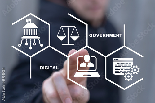 Man using virtual touch screen sees text: DIGITAL GOVERNMENT. Electronic government concept. Modern governance technologies. Digitalization. Digital transformation public government sector. photo