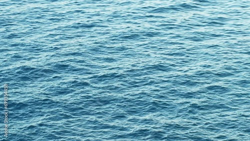 Blue surface of ocean with small waves, text and copy scape, background photo