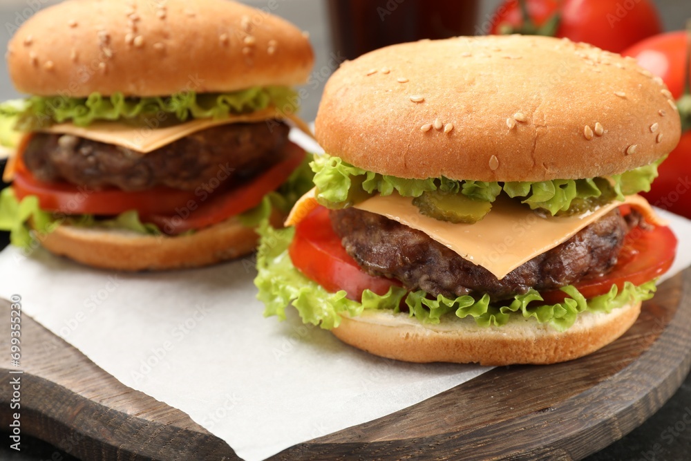 Tasty hamburgers with patties on table, closeup Tasty hamburgers with patties on table, closeup