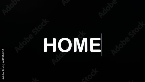 Detail of paragraph typing the word home on a dark background on screen photo