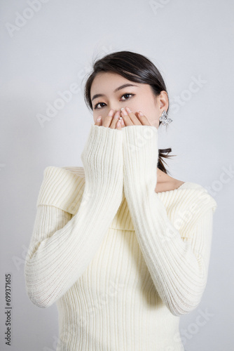 Pretty girl in a beige sweater