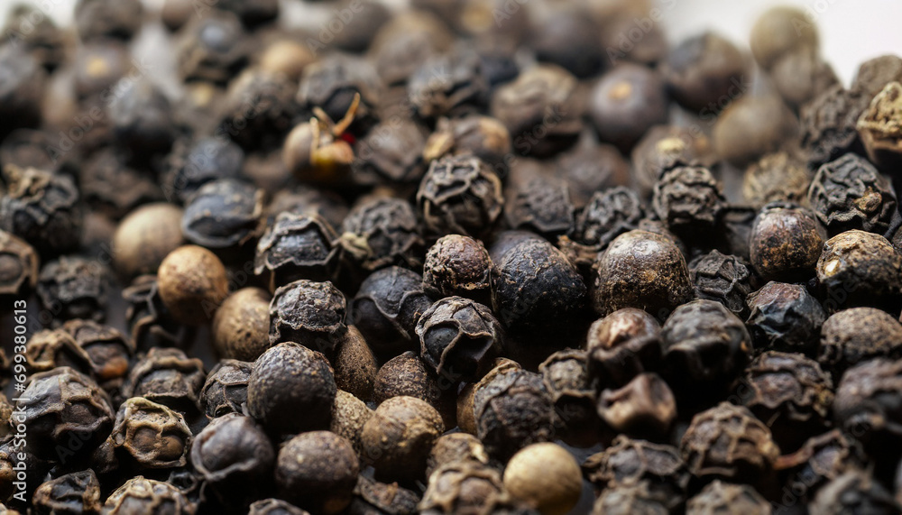 Black pepper close-up with blur effect. Abstract background and texture for design. Black pepper close-up with blur effect. Abstract background and texture for design.