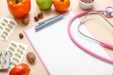 Blank clipboard, healthy food and pills on pink background, closeup
