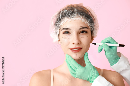 Plastic surgeon marking wom...