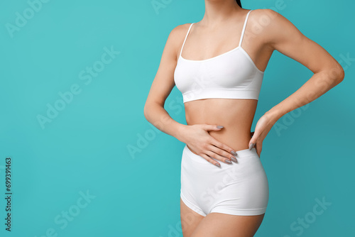 Young woman in underwear on...
