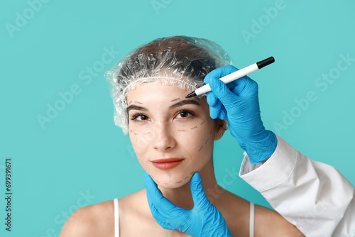 Plastic surgeon marking wom...