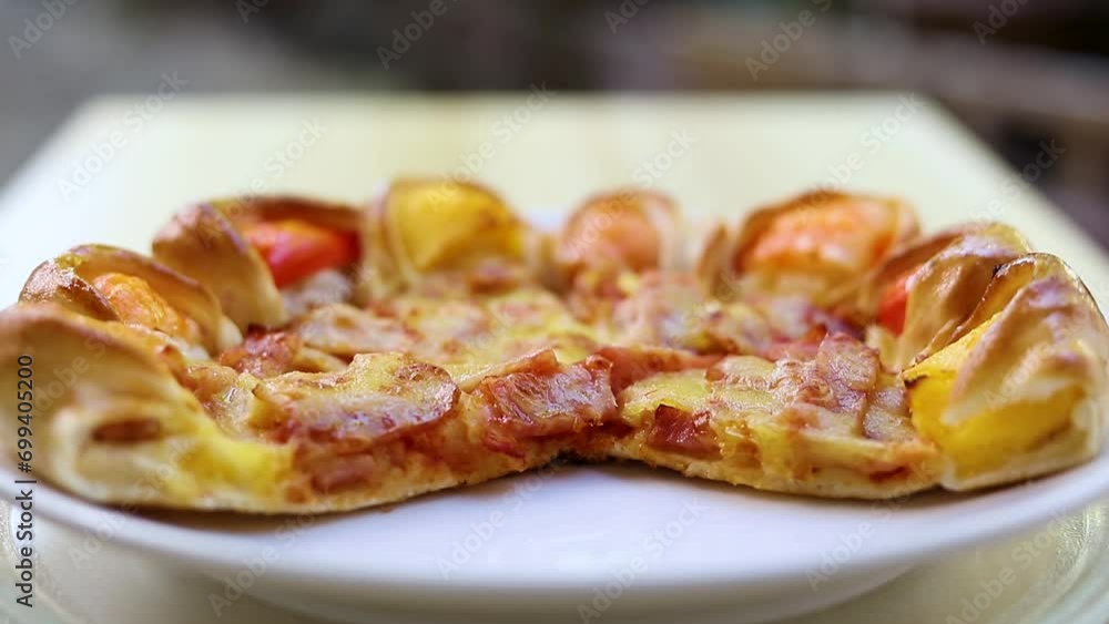 Homemade pizza in the kitchen in natural light.
Homemade pizza in the kitchen in natural light.