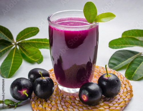 Juice of jamun fruit in a glass also called as java plum, jambolan plum, jambhul, syzygium cumini photo