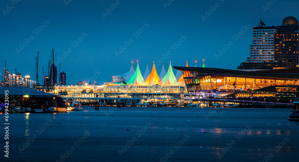 Green and orange colored Canada Place in Vancouver during the Christmas holidays