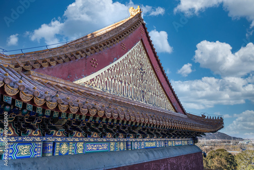 Blue sky and white clouds on the roof of the main hall of ancient Chinese style buildings photo