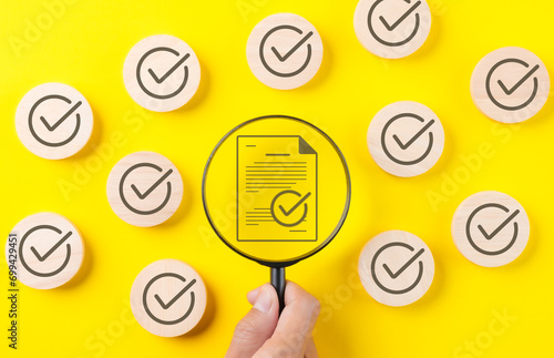 Quality assurance document control concept. Magnifying glass focus on correct sign mark document approved paperless and quality assurance approve, Checkmark round wooden, quality standard certificate,
