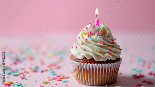 Birthday Cupcake with Candle on Pink Pastel Background