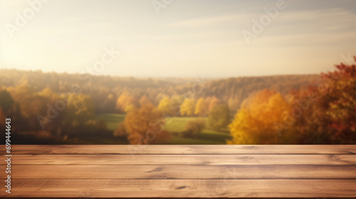 Wood table in autumn landscape with empty copy space