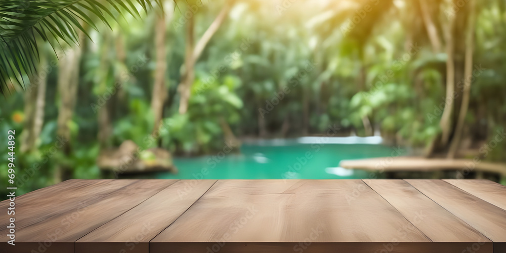 Empty wooden table in tropical forest for product presentation and green background.