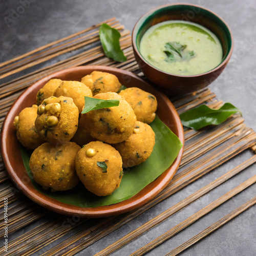 moong dal vada or pakoda also known as moongode served with green chutney photo