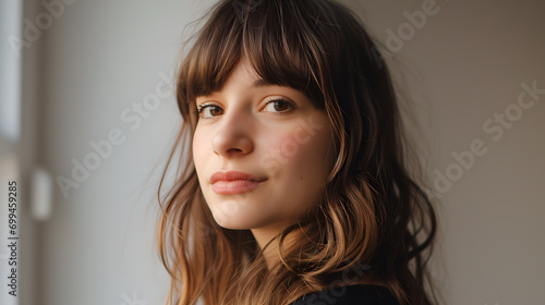Close-up of Curtain Bangs Hairstyle, young attractive model photo