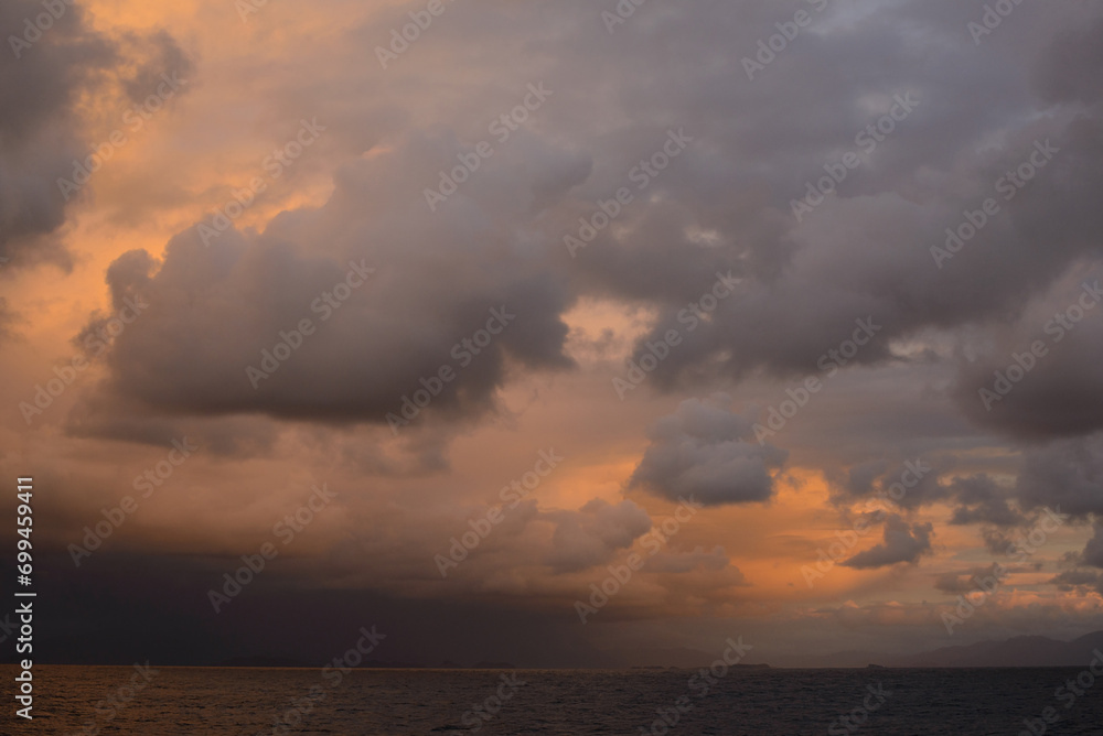 Vibrant Sunset Cloudscape Over Sea