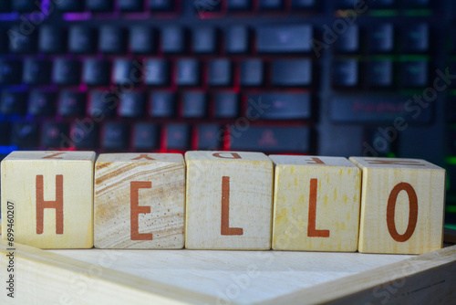 Wooden blocks make up the word "HELLO" in English. Wooden block object