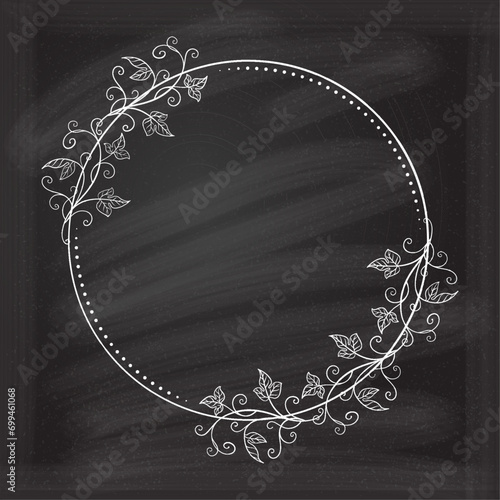 Vector round floral frame with ivy leaves decoration. Vintage style ivy stems wreath on a chalkboard background