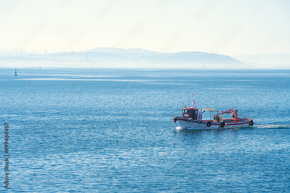 A vessel sails on the Atlantic Ocean coast, Galicia, Spain A vessel sails on the Atlantic Ocean coast, Galicia, Spain